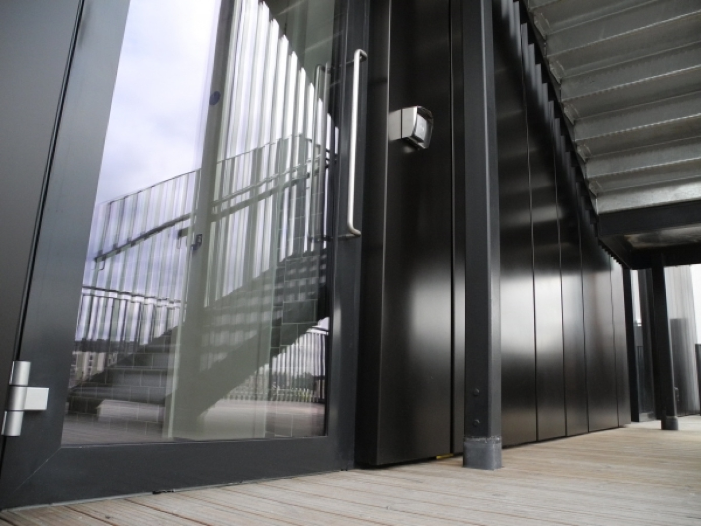 Large Swing Doors Into Rainscreen